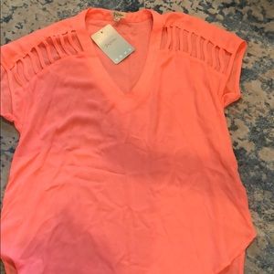 Neon pink/coral size S top with cutouts on sleeve